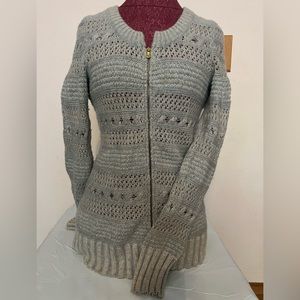Sleeping on snow light weight sweater, with shimmery metallic thread detail.